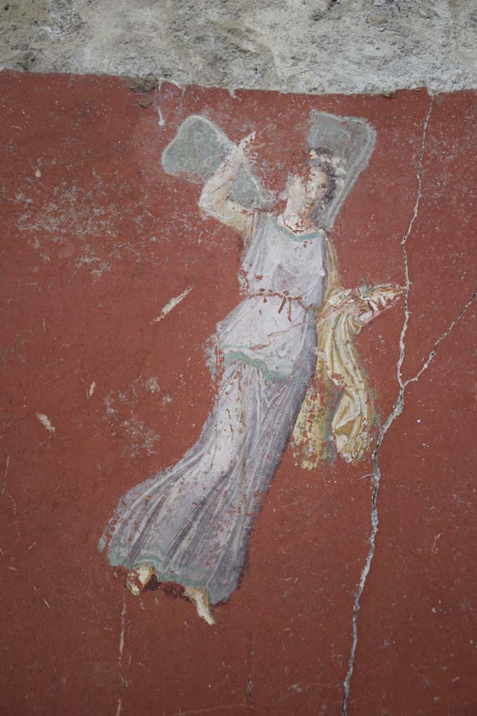 IX.12.6 Pompeii. February 2017. 
Room 3, painting of flying figure from south side of central painting on west wall.
Photo courtesy of Johannes Eber.
