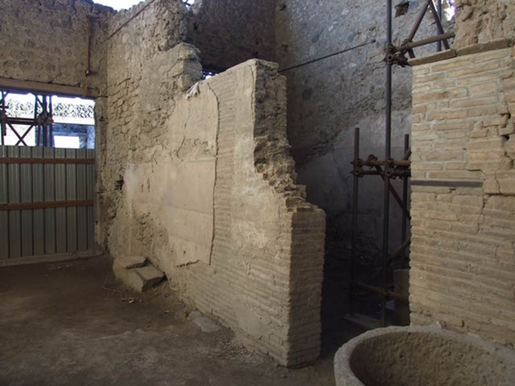 IX.12.6 Pompeii. March 2009. Room 10.  West wall, with door into room 11, probably used for grinding the corn and making bread.