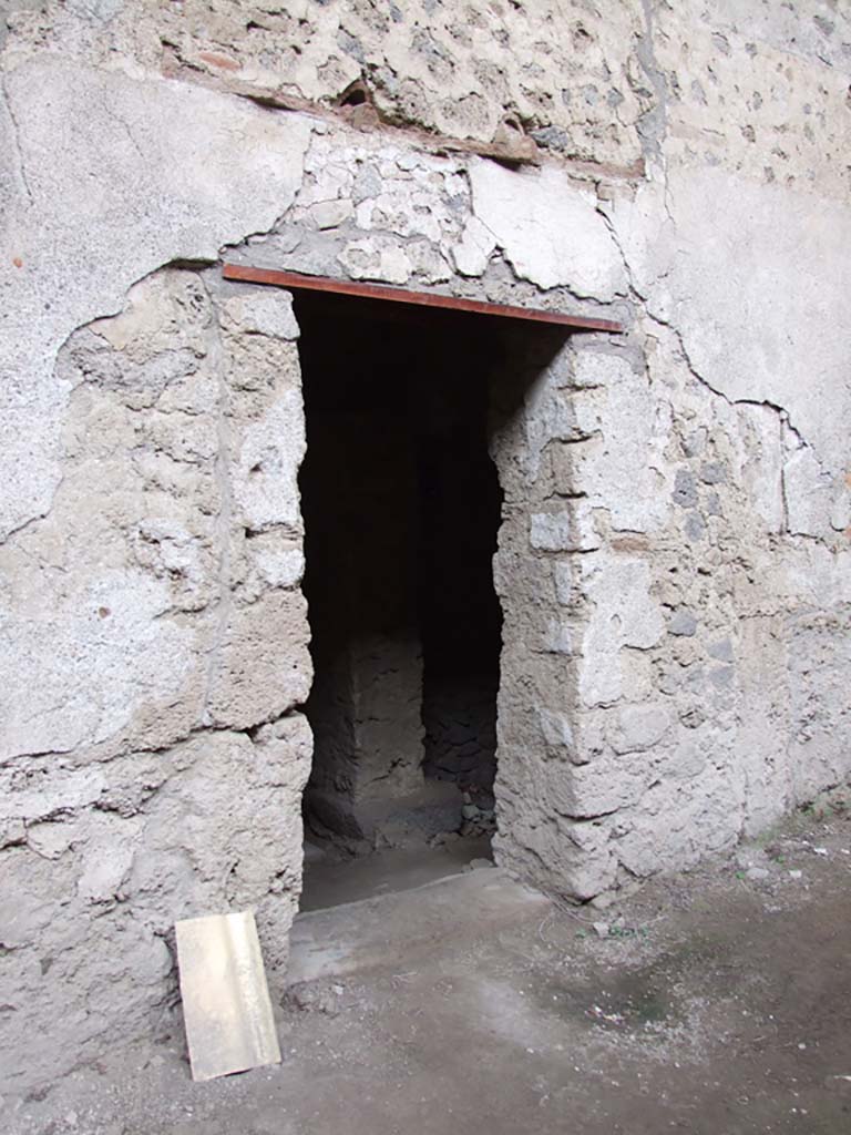 IX.12.9 Pompeii. December 2006. Street entrance to kitchen and latrine.
This would have been the secondary entrance of the house, to kitchen and latrine. 
The main entrance to the house is on the western side of the insula and has been identified as IX.12.A.

