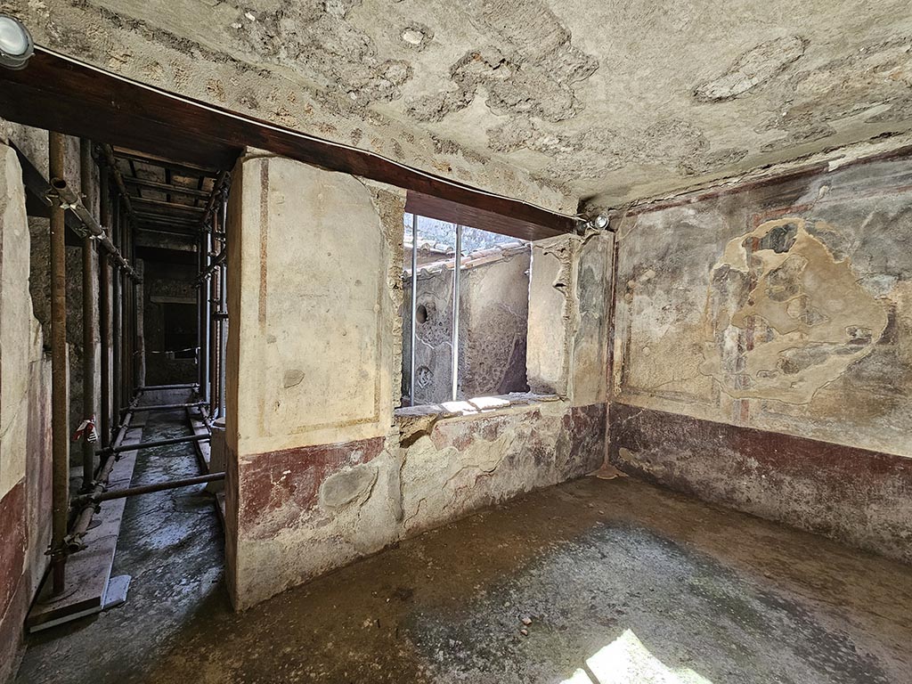 IX.13.3 Pompeii. November 2024. 
Room 22, looking towards doorway to kitchen courtyard and south wall. Photo courtesy of Annette Haug.
