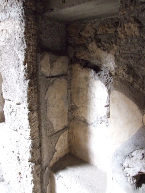 IX.13.1-3 Pompeii. March 2009. Room 2, north-east corner of atrium. 
Recess with 1 niche above, and 1 niche in east side.

