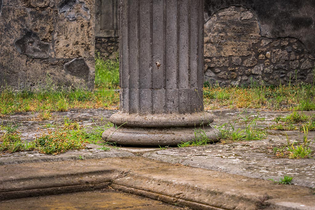 IX.14.4 Pompeii. July 2024. Base of column on south-west side of impluvium in atrium. Photo courtesy of Johannes Eber.