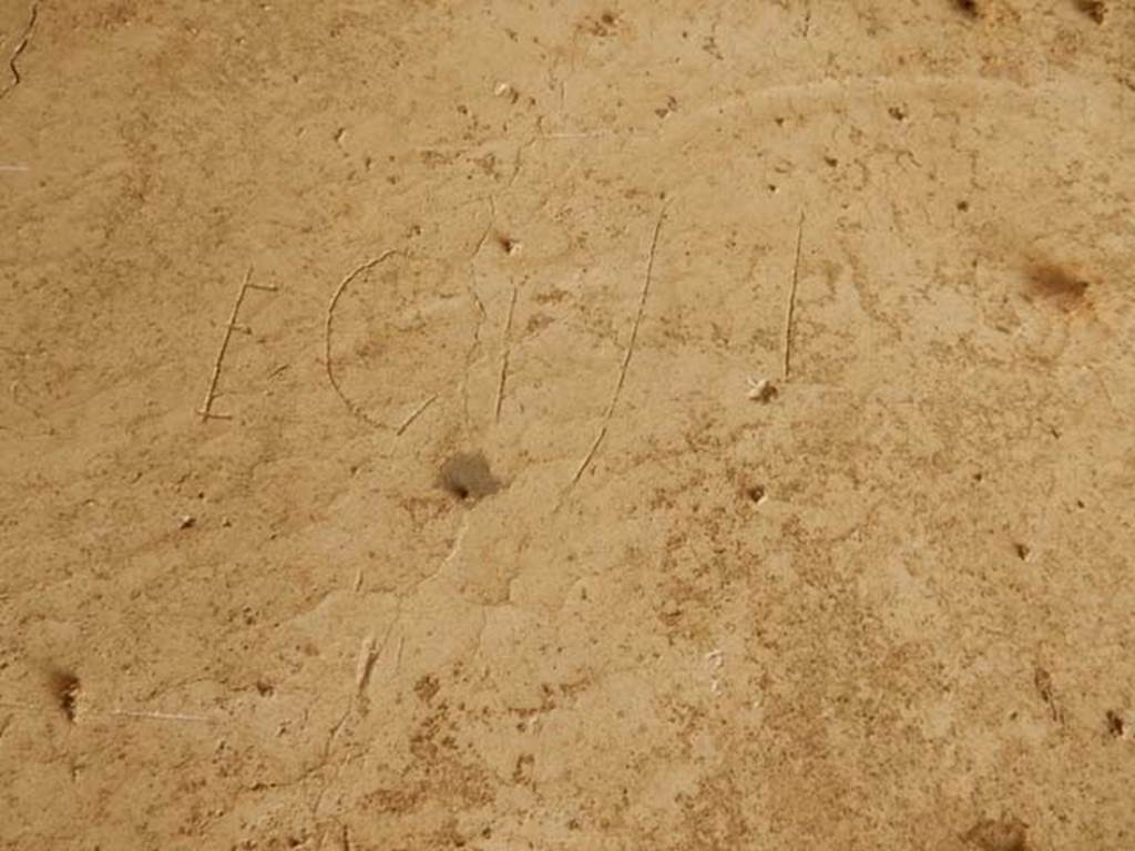 IX.14.4 Pompeii. May 2017. Graffito under the staircase on north side of peristyle.
This reads Ecisi.
Photo courtesy of Buzz Ferebee.
