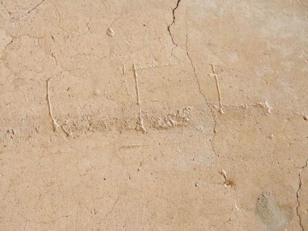 IX.14.4 Pompeii. May 2017. Graffito under the staircase on north side of peristyle.
This reads Cei.
Photo courtesy of Buzz Ferebee.
