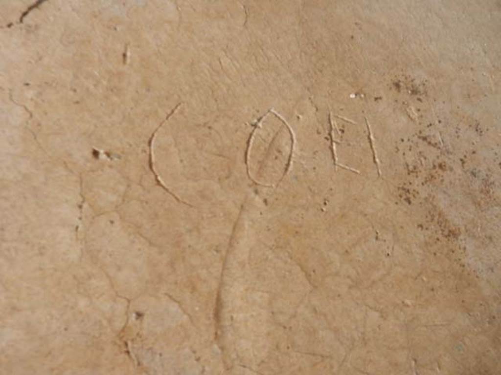 IX.14.4 Pompeii. May 2017. Graffito under the staircase on north side of peristyle.
This reads Coei.
Photo courtesy of Buzz Ferebee.

