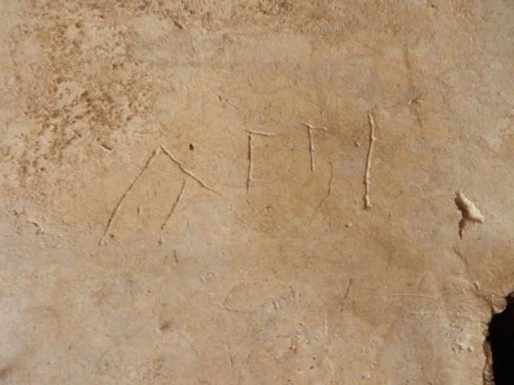 IX.14.4 Pompeii. May 2017. Graffito under the staircase on north side of peristyle.
This reads Atti.
Photo courtesy of Buzz Ferebee.
