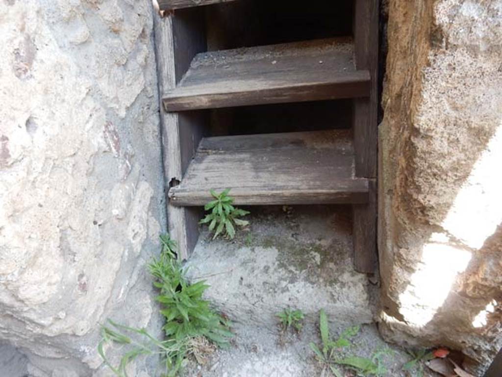 IX.14.4 Pompeii. May 2017. Base of modern reconstruction of wooden stairs to upper floor, numbered 35. Photo courtesy of Buzz Ferebee.
