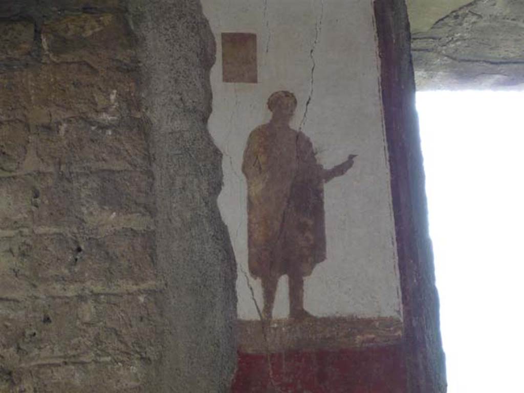 Villa San Marco, Stabiae, 2010. 
Room 8, north-east wall, detail of figure to left of window. Photo courtesy of Buzz Ferebee.
