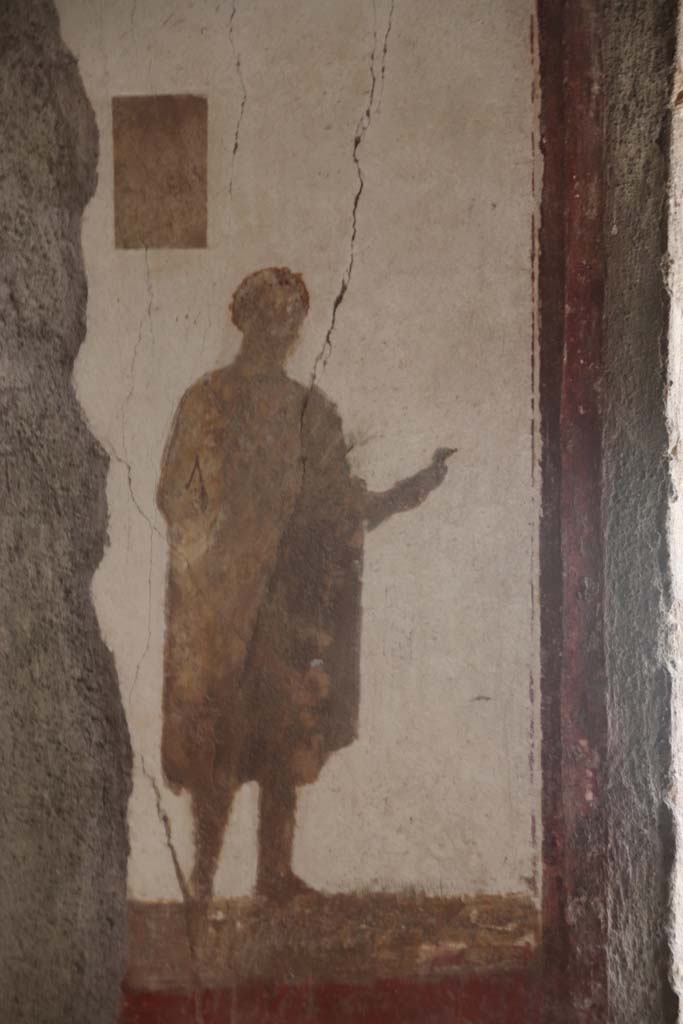 Villa San Marco, Stabiae, September 2019. 
Room 8, detail of figure to left of window on east wall. Photo courtesy of Klaus Heese.
