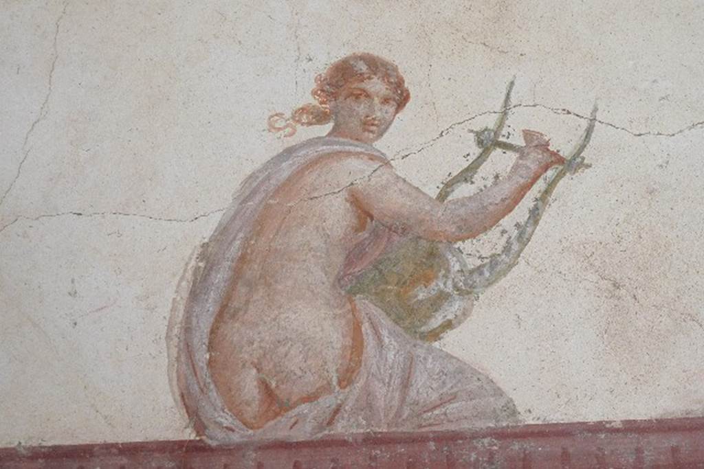 Castellammare di Stabia, Villa San Marco, July 2010. Room 30, painted figure with lyre from upper south wall in south-east corner. Photo courtesy of Michael Binns.


