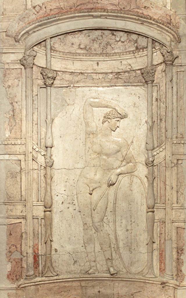 Castellammare di Stabia, Villa San Marco. Room 65, stucco relief of athlete from lower wall of niche 7 of the nymphaeum. Now in Naples Archaeological Museum.  Inventory number 9578.
According to Parslow, this stucco relief of a gymnast with a hoop was removed in August 1752, and taken to the museum at Portici. See Parslow, C.C. (1998). Rediscovering Antiquity: Karl Weber and the Excavation of Herculaneum, Pompeii and Stabiae. UK,Cambridge UP (p.178-9, fig.50). Underneath this was a painting of Diana and Acteon.
