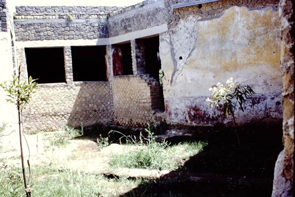 Villa San Marco, Stabiae, 1968. Room 19, garden, looking south-east across garden towards windows. The two window on the right would have given light into Corridor 32. According to Wilhelmina, this was the fourth garden of the Villa and had four large windows which let light into the area. A cast of a tree-root cavity was taken and this showed that the garden was shaded by the tree.
See Jashemski, W. F., 1993. The Gardens of Pompeii, Volume II: Appendices. New York: Caratzas, (p. 307, no. 615).
Photo by Stanley A. Jashemski.
Source: The Wilhelmina and Stanley A. Jashemski archive in the University of Maryland Library, Special Collections (See collection page) and made available under the Creative Commons Attribution-Non Commercial License v.4. See Licence and use details.
J68f1915

