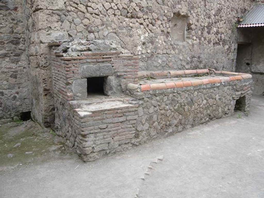 Villa of Mysteries, Pompeii. May 2012. Room 61, kitchen courtyard. Looking west towards the oven and hearth. Photo courtesy of Buzz Ferebee.

