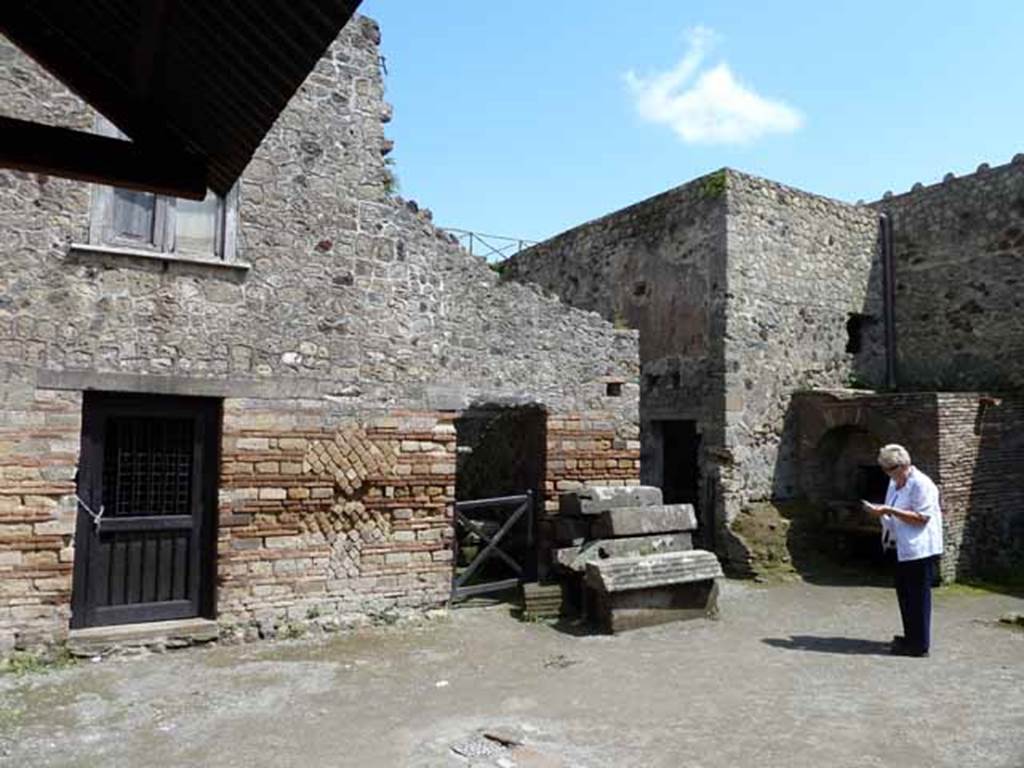 Villa of Mysteries, Pompeii. May 2010. Kitchen courtyard, room 61. East wall with doorways to rooms 36 and 37 and corridor 38.