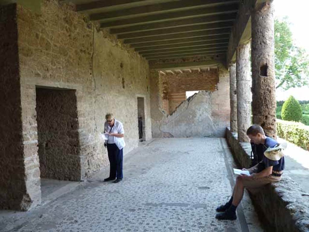 Villa of Mysteries, Pompeii. May 2010. Looking west along the portico P4, with doorways to corridor F2, and room 13.