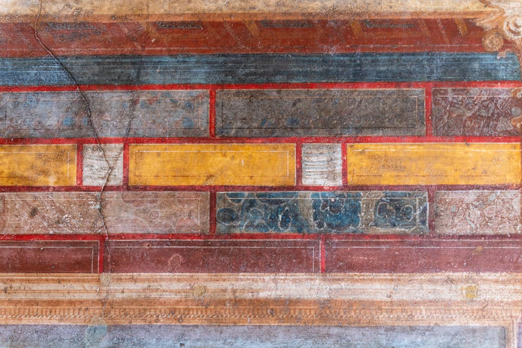 Villa of Mysteries, Pompeii. October 2023. Room 8, detail from upper east wall at north end. Photo courtesy of Johannes Eber.