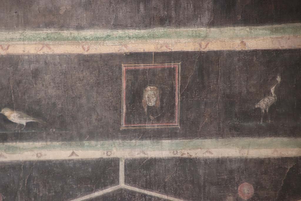 Villa of Mysteries, Pompeii. September 2021. Room 2, tablinum, detail of mask on west wall. Photo courtesy of Klaus Heese.