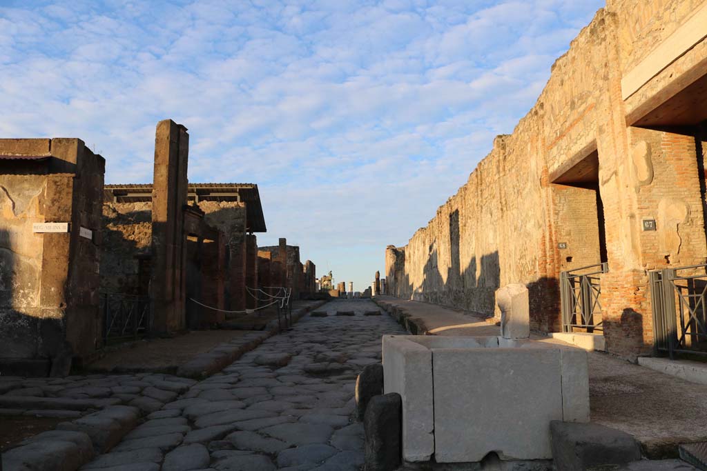 Via dell’Abbondanza, Pompeii. December 2018.
Looking west between VIII.3, on left, and VII.9.68 and 67, on right. Photo courtesy of Aude Durand.
