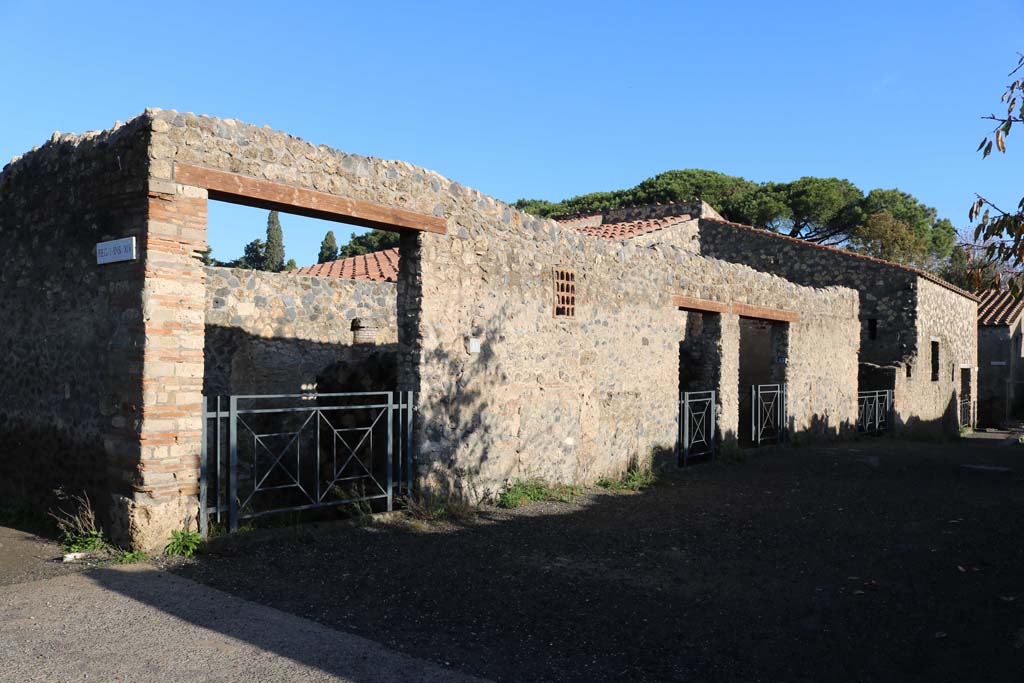 Via della Palestra, Pompeii, north side. December 2018. 
Looking east from I.14.11 towards I.14.15, on right. Photo courtesy of Aude Durand.
