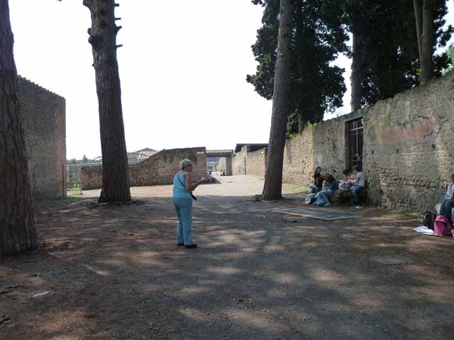 Via di Castricio, north side, May 2010. Looking north-west towards the junction with Vicolo della Venere, between II.2 and II.3.