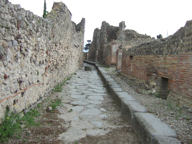 Vicolo dei Soprastanti, south side, June 2012. Looking west from junction with Vicolo del Farmacista, on right.