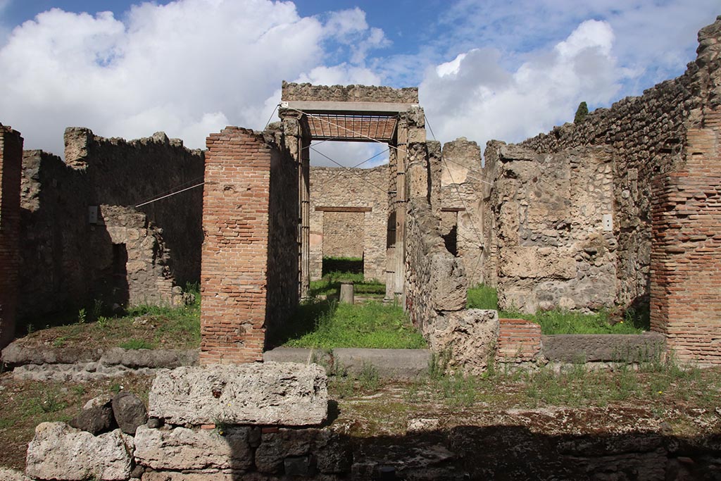 Vicolo del Conciapelle, north side, Pompeii. October 2024. 
Doorways to I.2.29 on left, I.2.28 in centre, and I.2.27 on right. Photo courtesy of Klaus Heese.
