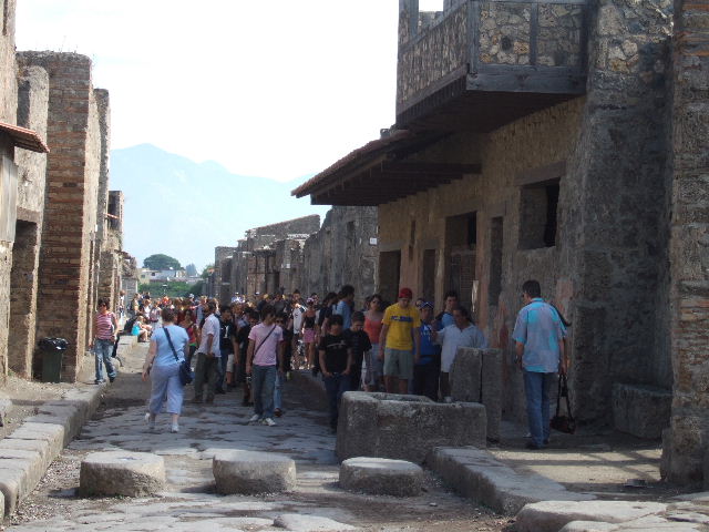 Via dell’Abbondanza, south side. May 2010. Looking towards junction with Vicolo della Nave Europa, between I.12 and I.11.