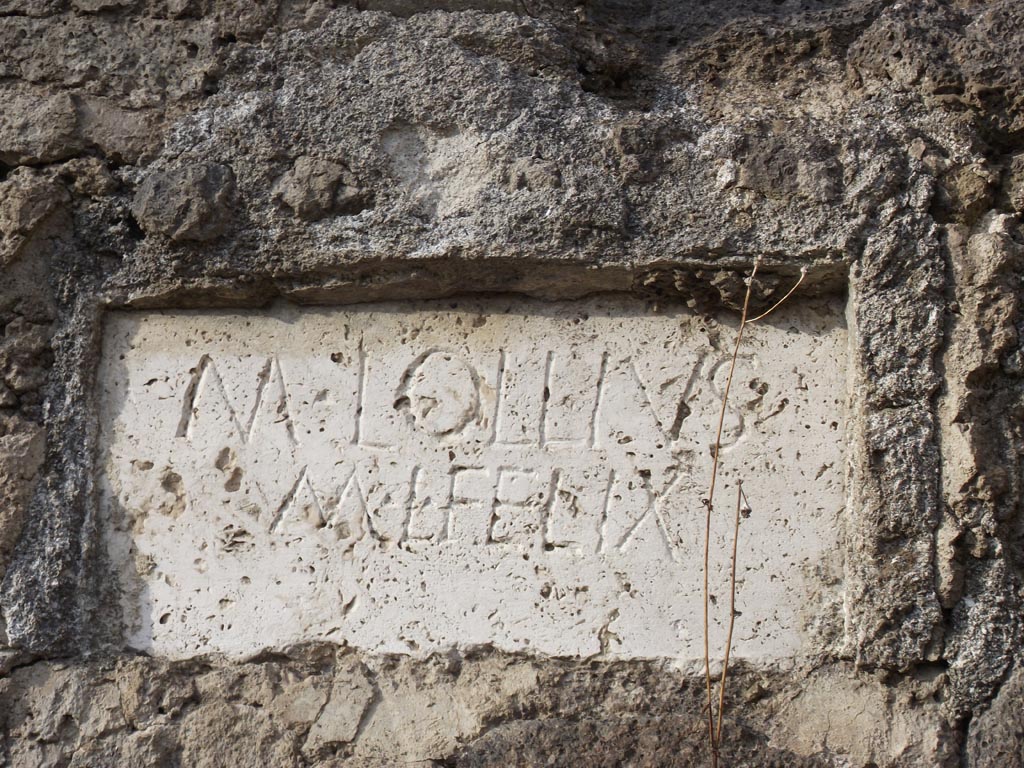 FPNI Pompeii. August 2011. Plaque on west end of south side with inscription:
M  LOLLIVS  
M  L  FELIX
Photo courtesy of Peter Gurney.
