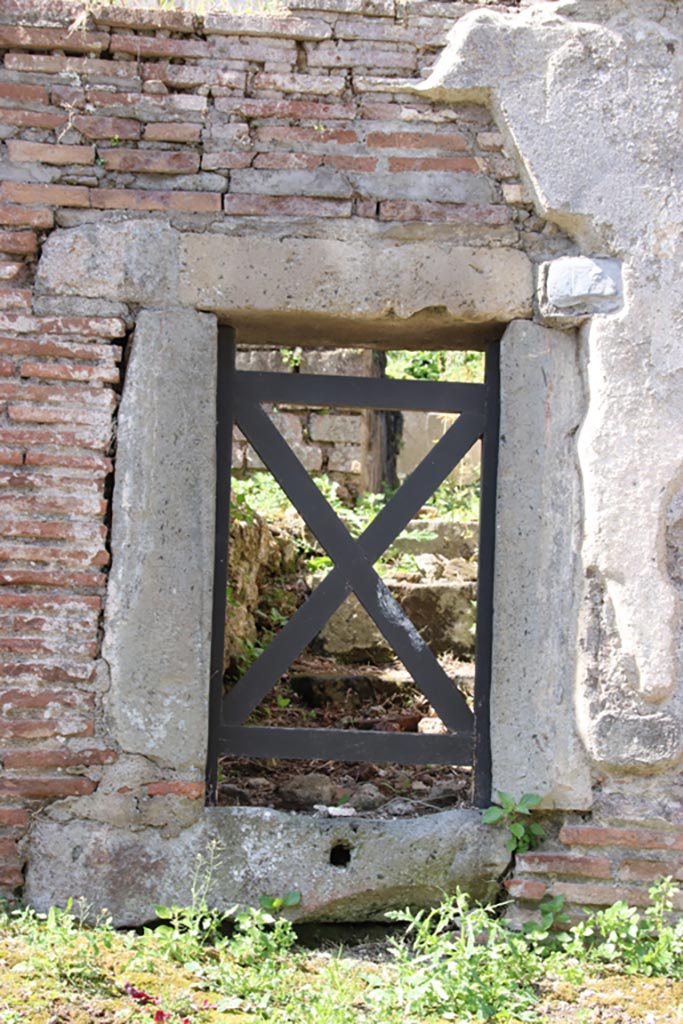 HGW18 Pompeii. May 2024. 
Looking west towards small doorway to tomb at north end of east wall. Photo courtesy of Klaus Heese.
