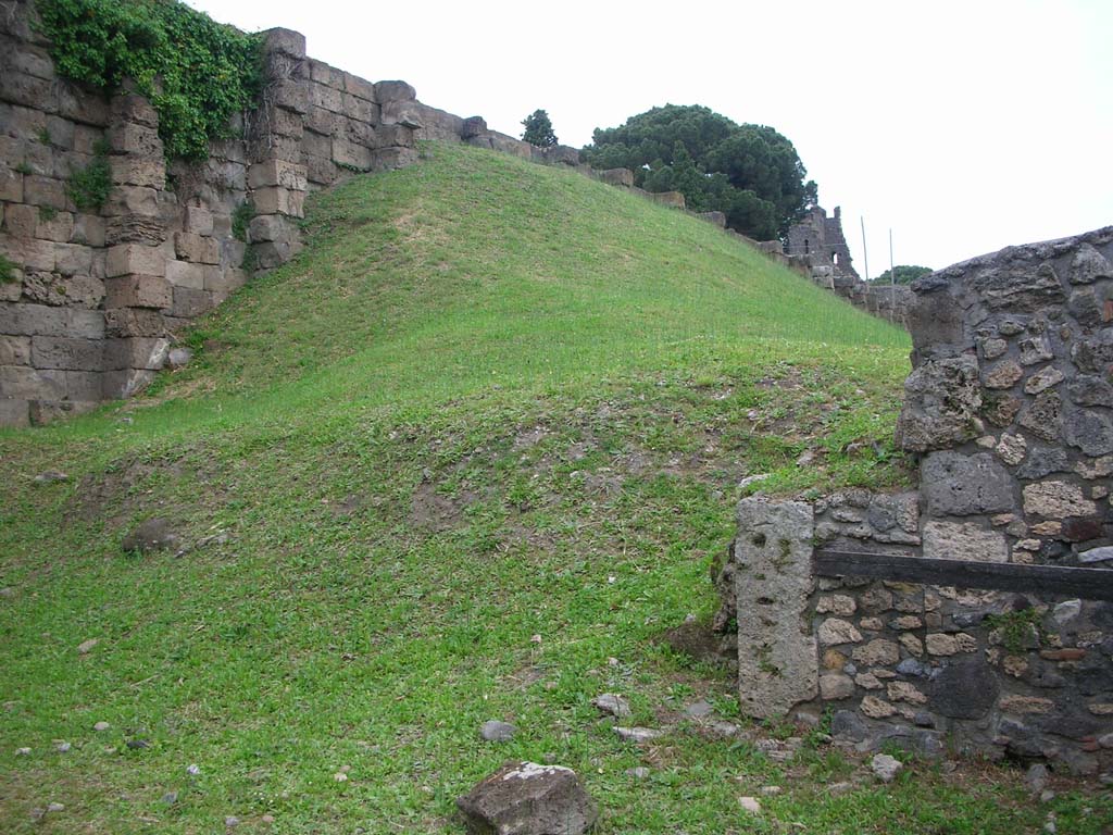 City Wall on east side of Tower XI, on north side of Pompeii. May 2010. 
Looking east towards Tower X, with VI.9.1, on right. Photo courtesy of Ivo van der Graaff.
