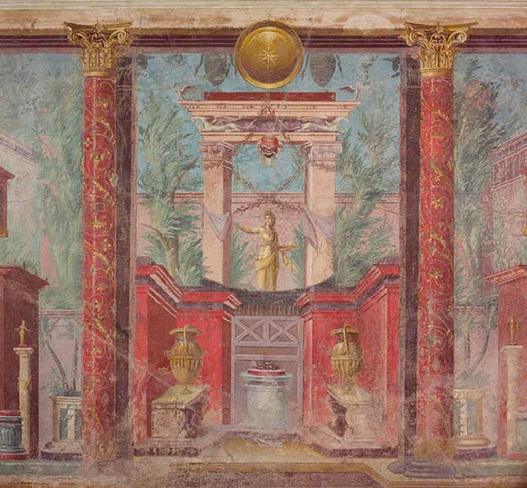 Villa of P Fannius Synistor at Boscoreale. Cubiculum M. Second panel from south end of east wall. According to Barnabei, this painting depicts a statue of Diana Lucina, the protecting goddess of the start of life. A plate full of gifts is in her left hand and her right arm is stretched out to distribute those gifts. She is within a sacred portal wrapped in white ribbons. From the portal hangs a bearded mask of a young faun and above is a lintel supported on the wings of two swans. On top of the lintel are two silver urns and between them is a round gold shield. At the base is a small red walled area with an altar with offering on top and two vases on benches. Either side are red columns painted with flowers and climbers. See Barnabei F., 1901. La villa pompeiana di P. Fannio Sinistore. Roma: Accademia dei Lincei. p.75, Fig. 18.