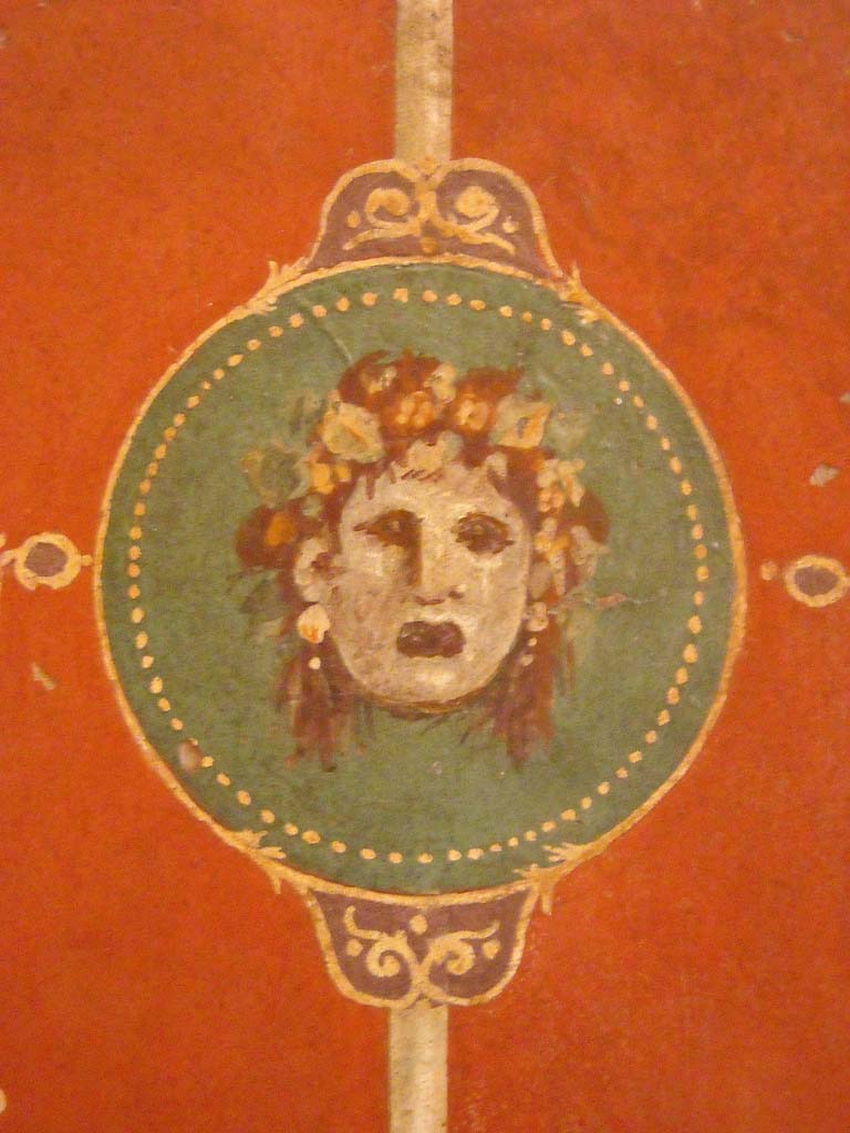 Villa Agrippa Postumus. Boscotrecase. Room 16, east wall.
Detail of mask from centre of wall.
Now in Naples Archaeological Museum. Inventory number 147505.
