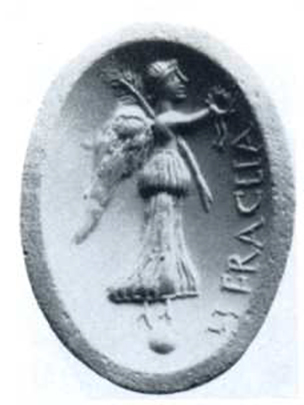 Boscotrecase, Villa of Agrippa Postumus, room “5”. Cameo with winged Vittoria, standing on a globe, with palm frond over shoulder and crown in hand.
On the cameo is the inscription HERACLIA.
Also found was another similar corniola, in which is engraved Minerva armed with helmet, shield and lance.
(The rod is leaning against the shoulder in the oblique direction; of beautiful effect is the movement of the garments in both figures).
See Notizie degli Scavi di Antichità, 1922, p. 463, fig. 4.
