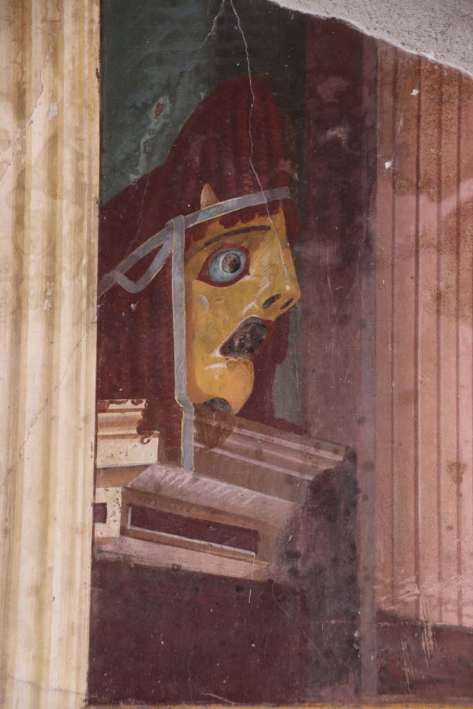 Oplontis Villa of Poppea, September 2021.  
Room 15, detail of tragic mask from north end of east wall. Photo courtesy of Klaus Heese.

