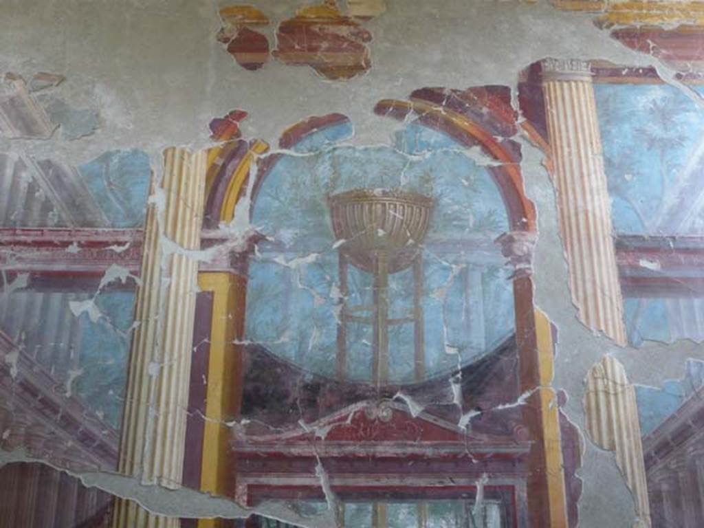 Oplontis, May 2011. Room 15, east wall, detail of painting of the Delphic tripod.  
Photo courtesy of Buzz Ferebee. 

