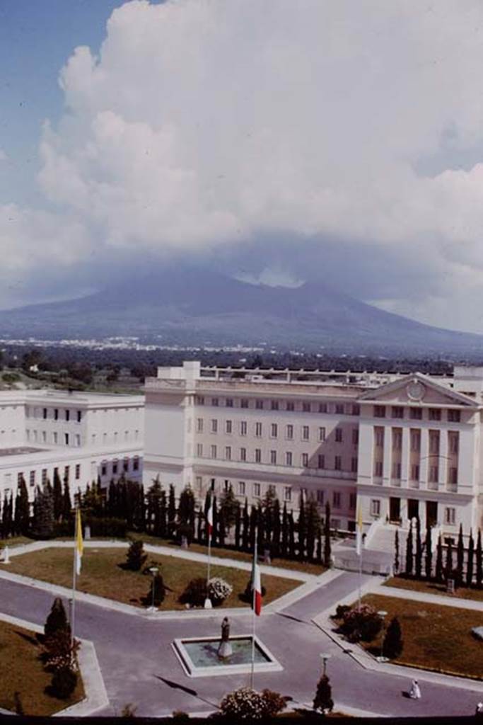 Looking north from hotel in modern Pompeii, towards a cloud covered Vesuvius. 1964.  Photo by Stanley A. Jashemski.
Source: The Wilhelmina and Stanley A. Jashemski archive in the University of Maryland Library, Special Collections (See collection page) and made available under the Creative Commons Attribution-Non-commercial License v.4. See Licence and use details.
J64f1391
