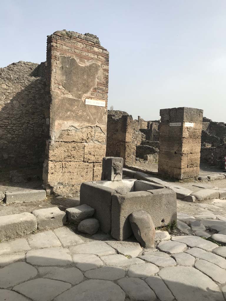 Fountain outside VI.13.7 on north side of Via della Fortuna. April 2019. 
Photo courtesy of Rick Bauer.
