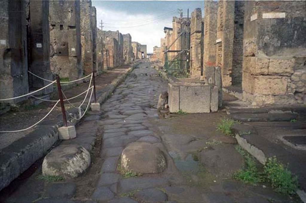 Fountain outside VI.13.7. Via della Fortuna. July 2011. Looking west towards fountain between VII.4 and VI.13. Photo courtesy of Rick Bauer.
