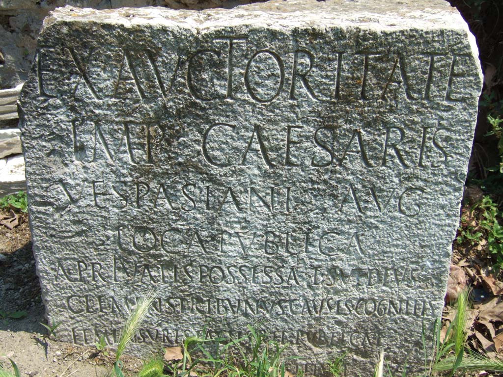 Vesuvian Gate Pompeii. May 2006. VG5 Cippus of Titus Suedius Clemens. The Cippus is inscribed:

Ex auctoritate 
imp(eratoris) Caesaris 
Vespasiani Aug(usti)
loca publica
a privatis possessa T(itus) Suedius 
Clemens tribunus causis cognitis 
et mensuris factis rei publicae
Pompeianorum restituit.

By virtue of authority conferred upon him by the Emperor Vespasian Caesar Augustus, 
Titus Suedius Clemens, tribune, having investigated the facts and taken measurements,
restored to the citizens of Pompeii public places illegally appropriated by private persons.

Similar Cippi were found at the Porta Ercolano, Porta Marina and the Porta Nocera.
The wording “rei publicae Pompeianorum” on one of these, discovered in 1763, was the first positive identification that the site was Pompeii. 
Until then scholars had divided opinions on the city buried under Cività. Many, including the first official excavators, thought it was the ancient city of Stabiae.
See Conticello, B., Ed, 1990. Rediscovering Pompeii. Rome: L’Erma di Bretschneider. (p. 225).
