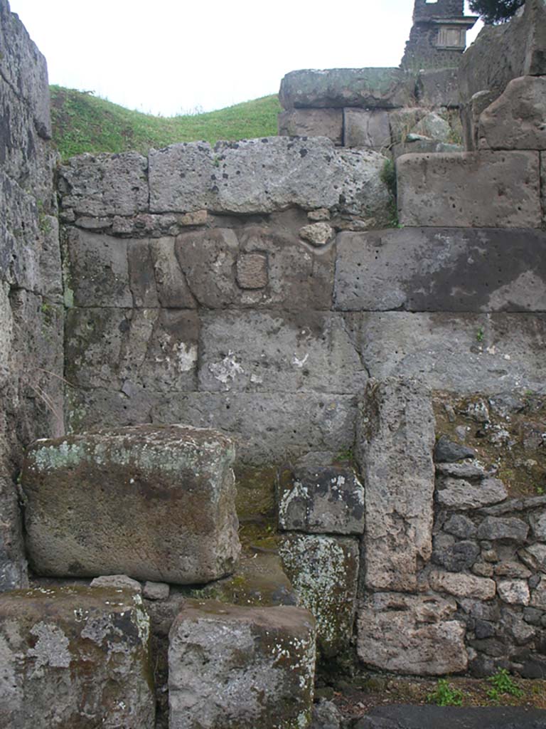 Vesuvian Gate Pompeii. May 2010. Detail from west wall at north end of gate. Photo courtesy of Ivo van der Graaff.
According to Sogliano –
“In the south-west corner [of area C, at the north end of the gate] there was a masonry altar [d on the plan, as mentioned above] with edges in relief and dressed entirely in plaster and with a painted representation now completely unrecognizable. Next to this altar there was another [e on the plan], much smaller, also with an edge in relief.” 
See Notizie degli Scavi di Antichità, 1906, p. 97-100.

