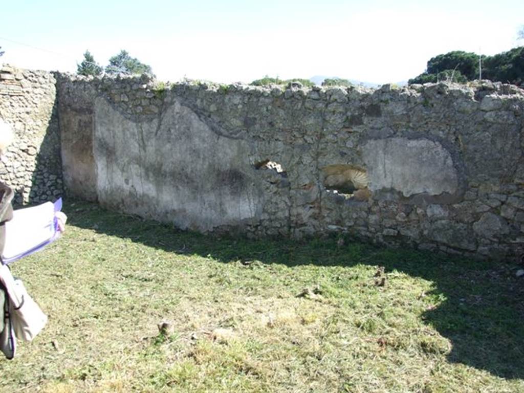 I.2.17 Pompeii. March 2009. Room 13, south wall, looking south-east.
According to Jashemski, the peristyle garden, excavated in 1873, had a portico on the north and west side. It was supported by two pillars, one on the north-west corner, the other in the middle of the north side. See Jashemski, W. F., 1993. The Gardens of Pompeii, Volume II: Appendices. New York: Caratzas. (p.23)
