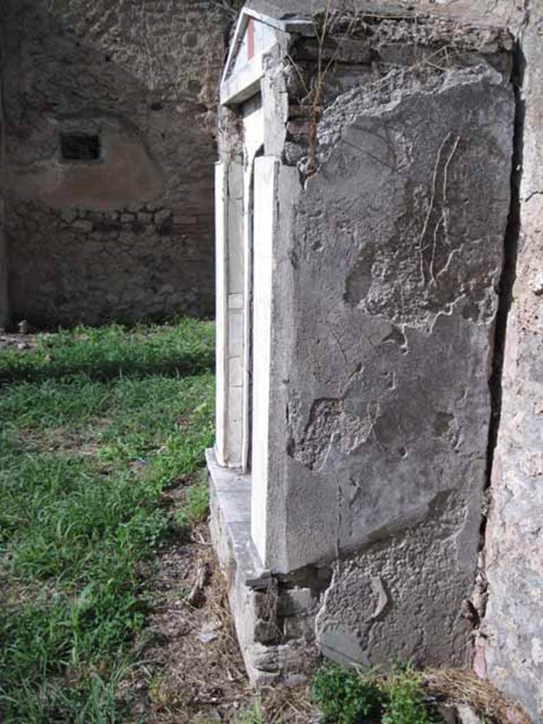 I.2.17 Pompeii. September 2010. South side wall of shrine, looking north along east wall in room 13. Photo courtesy of Drew Baker.
