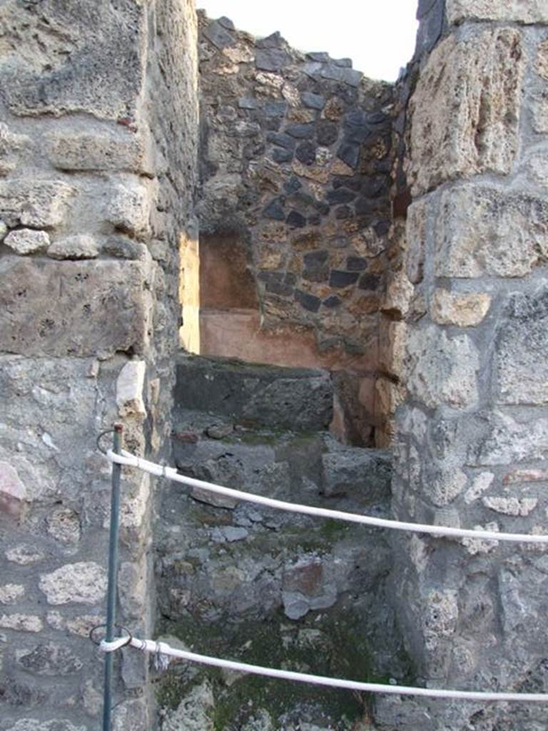 I.4.25/1.4.5 Pompeii. December 2007. Room 16, stairs to upper floor, looking south from in the tablinum.