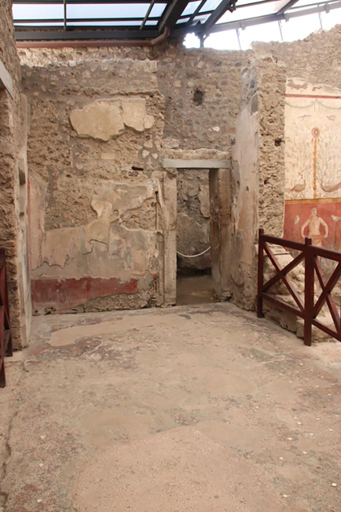 I.6.15 Pompeii. October 2023. 
Looking west across south portico towards doorway to room 8. Photo courtesy of Klaus Heese.
