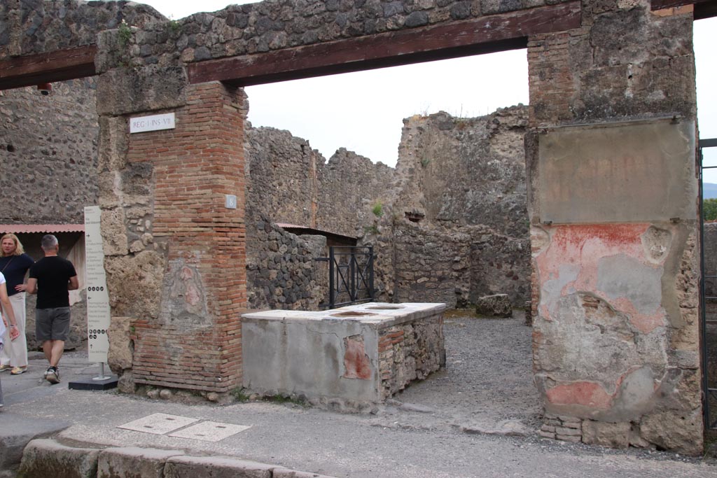 I.7.8 Pompeii. May 2024. Looking south-east towards entrance doorway and counter. Photo courtesy of Klaus Heese.