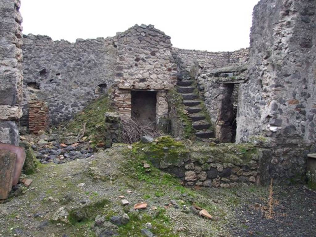 I.8.18 Pompeii. December 2007. Looking south-east across atrium to remains of small peristyle area and stairs on east wall.