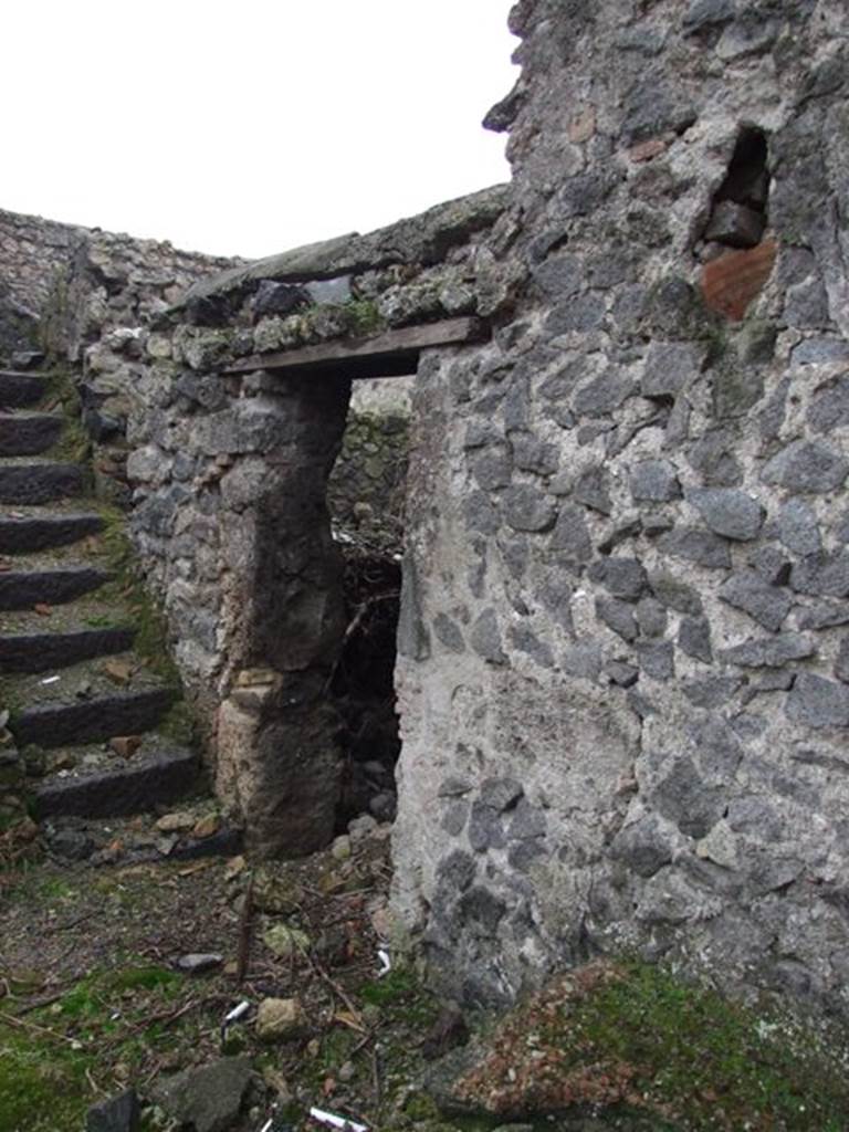 I.8.18 Pompeii. December 2007. Doorway to kitchen on south side of staircase.