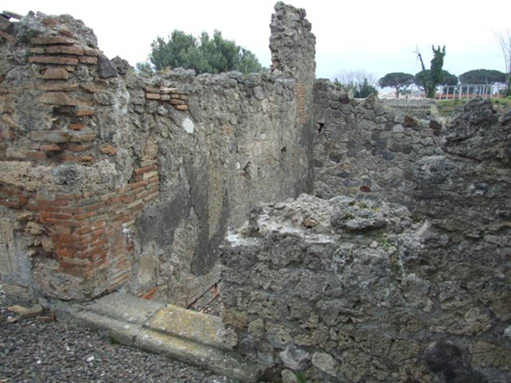 I.9.1 Pompeii.  March 2009.  Room 10. Garden area. 
Doorway into room at south end of west side. The floor is no longer there, and the drop is down into the workshop complex at a lower level.
