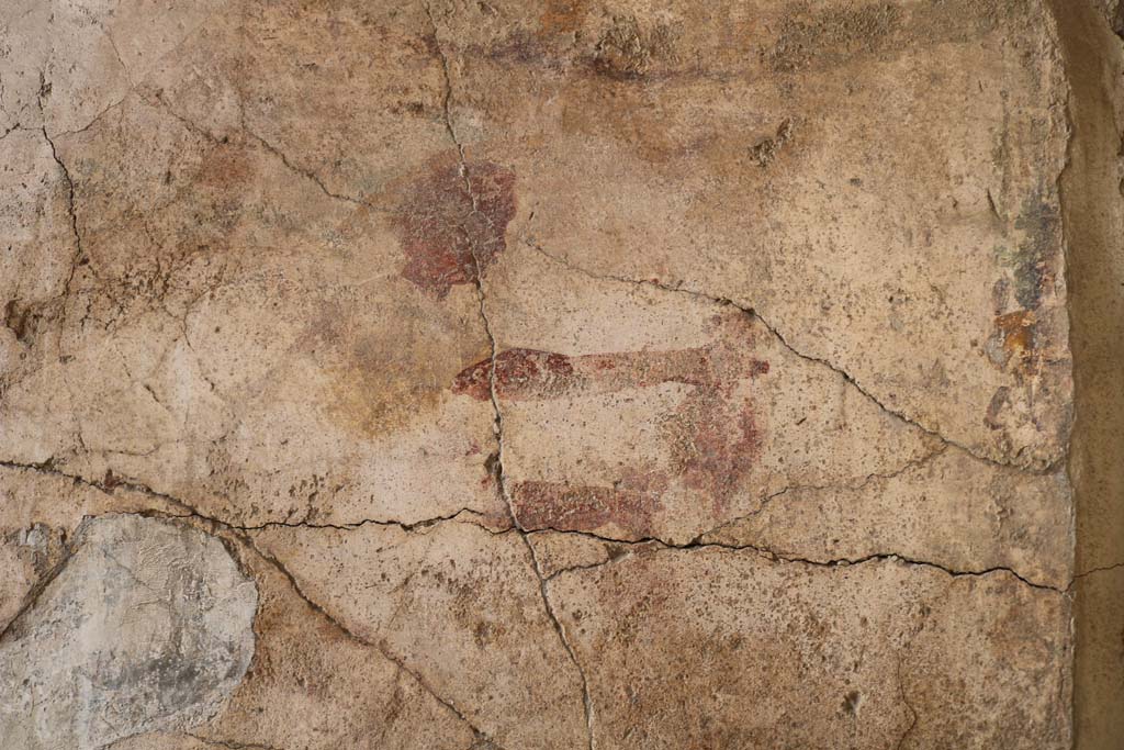 1.9.1 Pompeii. December 2018. East wall of vestibule, detail of remains of wall painting of Mercury. Photo courtesy of Aude Durand.