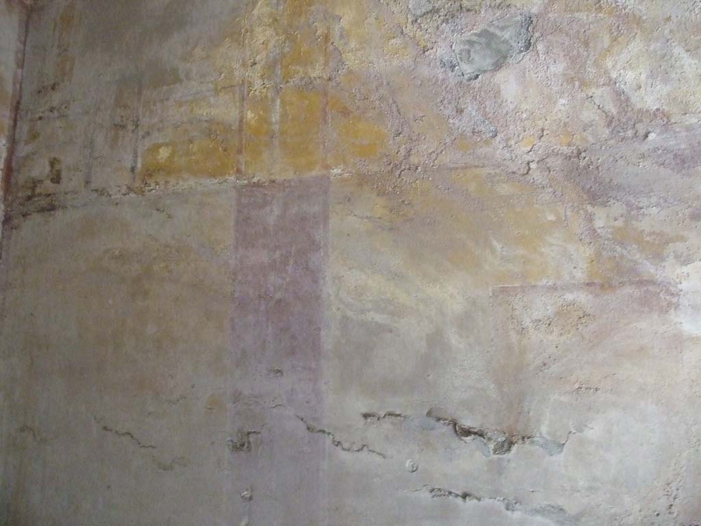I.9.3 Pompeii. March 2009. Room 10, remains of painted decoration on south wall, with an illegible central painting, on the right.  